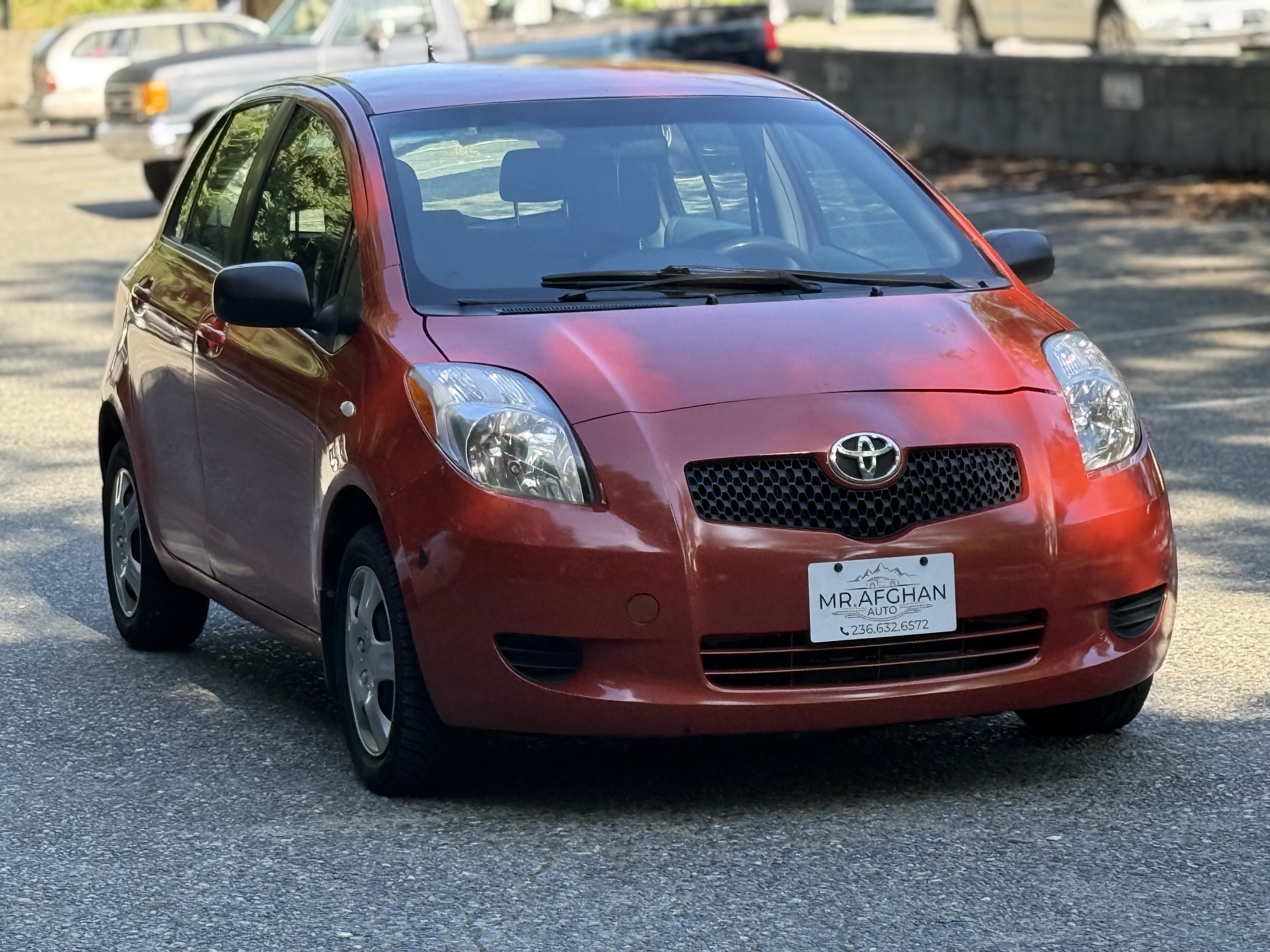 Orange 2007 Toyota Yaris Hatchback Front-Wheel Drive Automatic