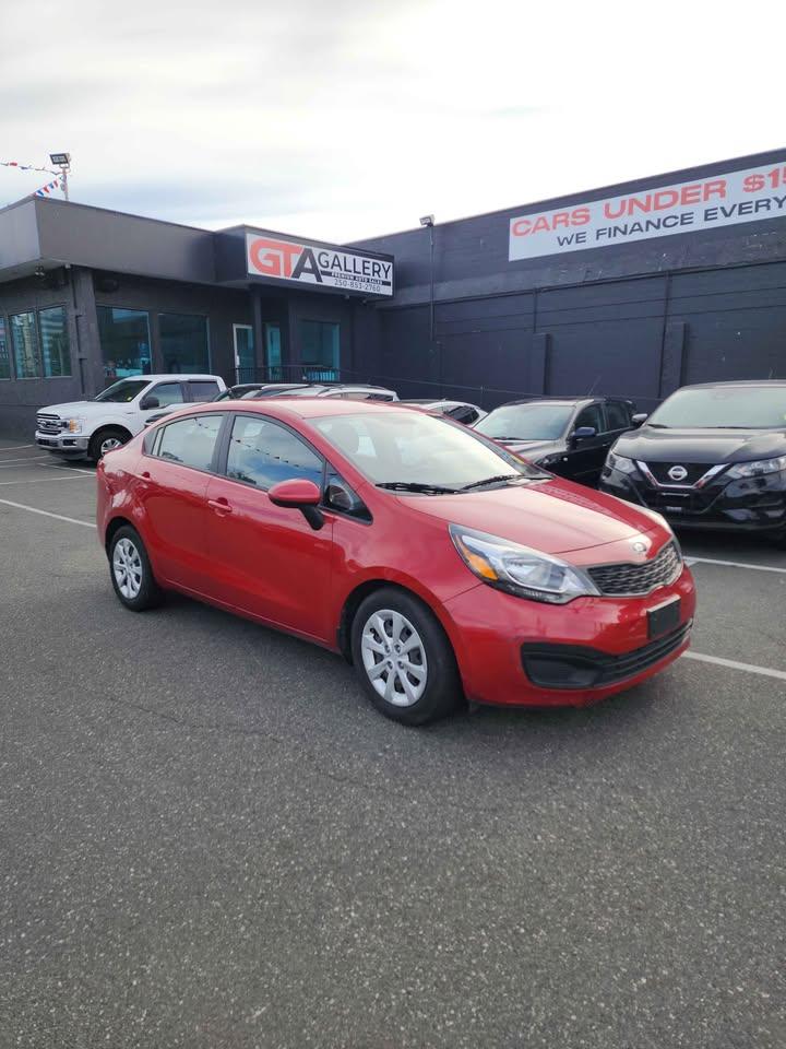 Red 2014 Kia Rio LX Sedan Front-Wheel Drive Automatic