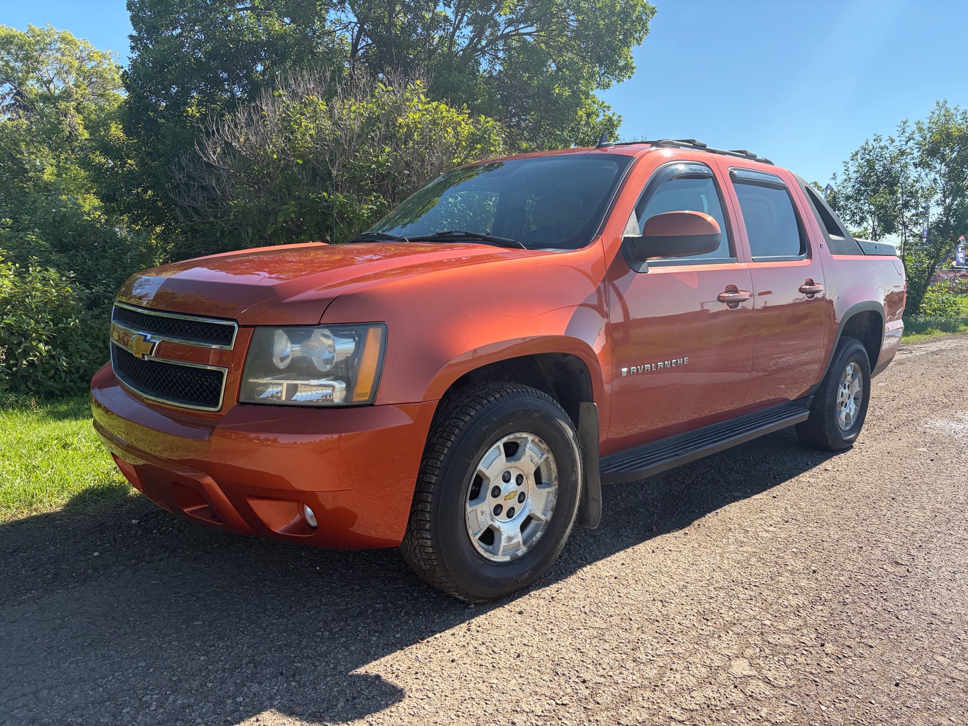 Orange 2007 Chevrolet Avalanche Pickup Truck Four-Wheel Drive Automatic