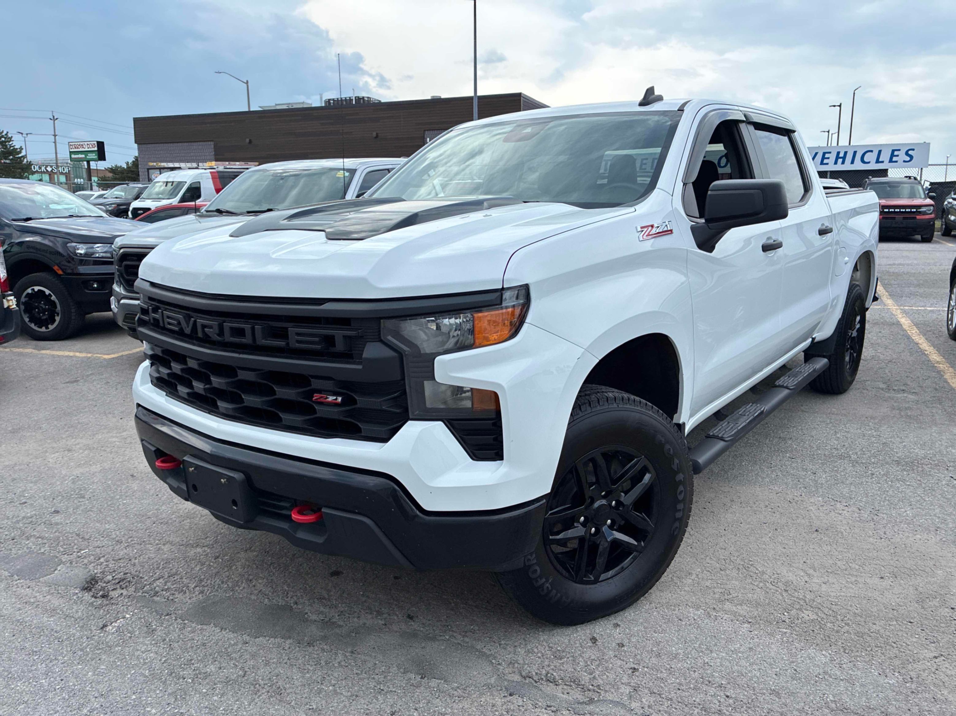 White 2023 Chevrolet Silverado 1500 Custom Trail Boss Crew Cab 4WD Pickup Truck Four-Wheel Drive Automatic